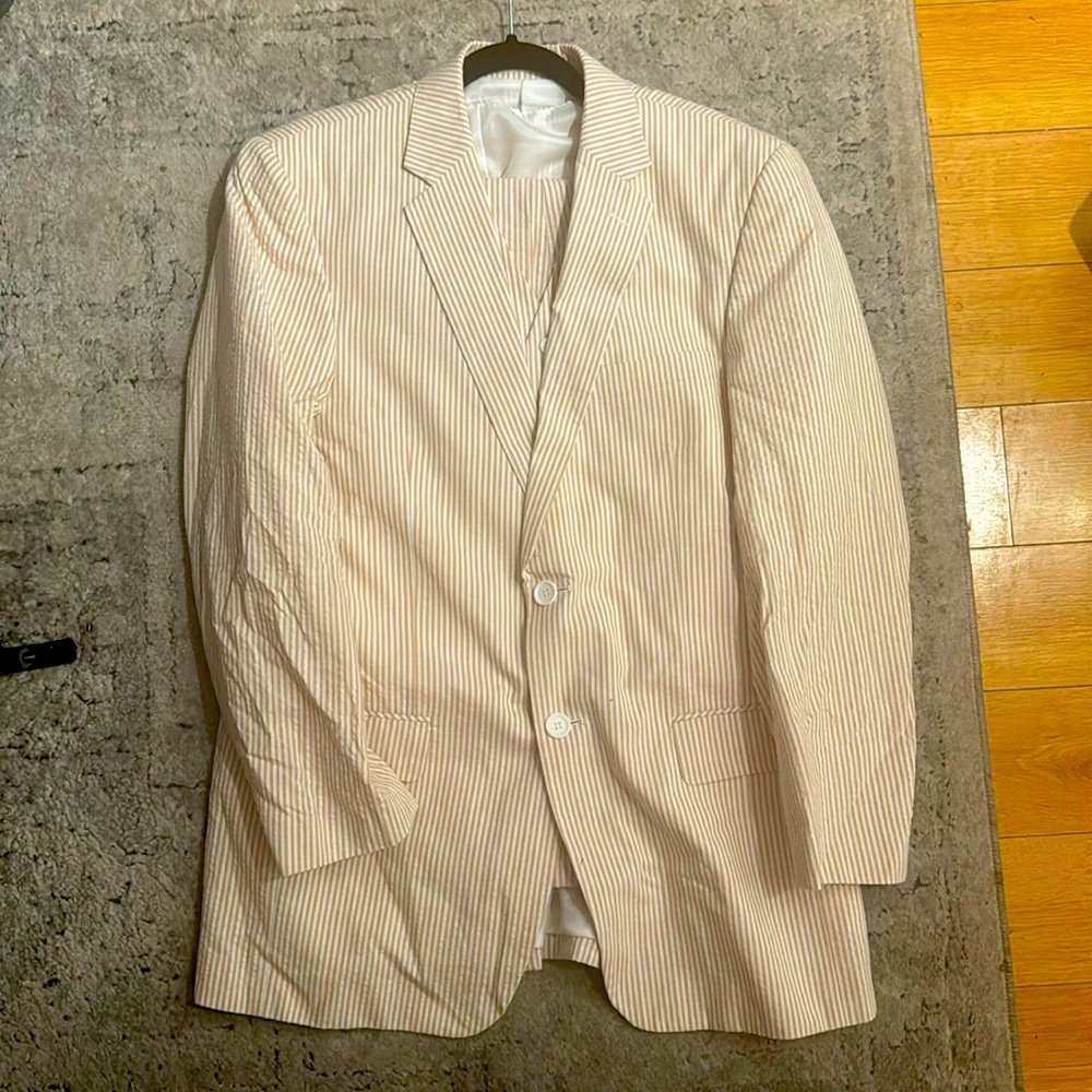 This is a 3 piece seersucker suit. The suit includes a jacket, pants and vest.